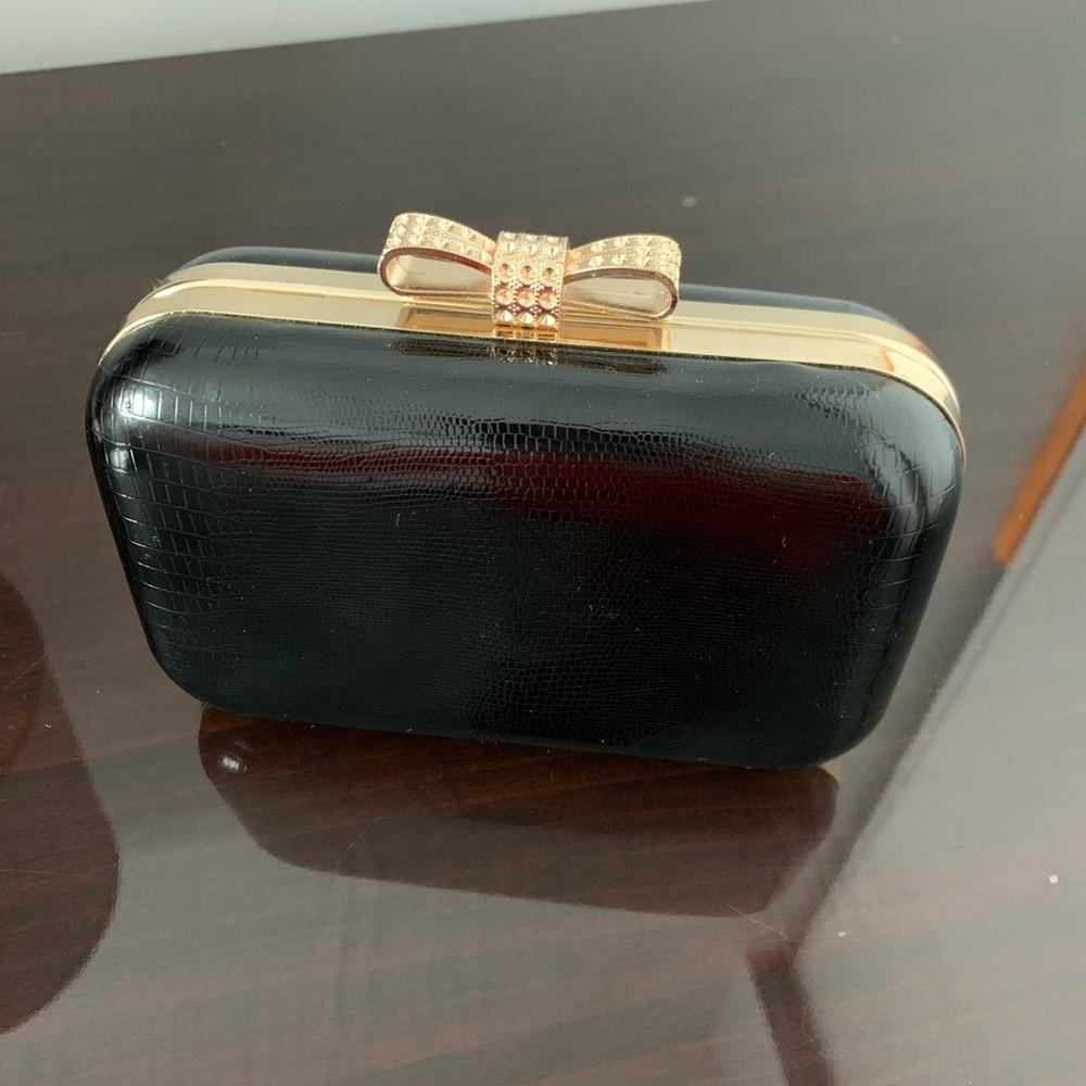 Evening clutch, black, no brand name.